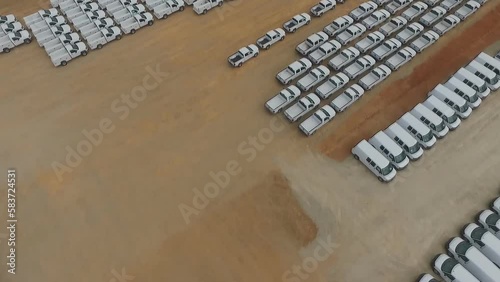 Aerial view of new cars in open-air parking lots, Saudi Arabia desert, near the city of El Riyah. photo