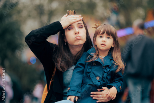 Stressed Mother Visiting a Fun Fair with her Little Girl. Mom failing to take care of family outdoors trip forgetting something important

 photo