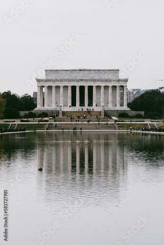 Washington D. C. United States. November 29, 2022: abraham lincoln monument on a gray day and reflection in the water.