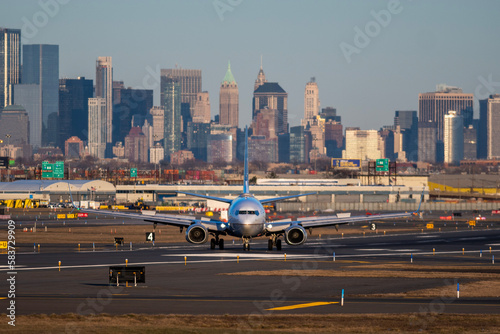 Airplane of airlines is going on taxiway after landing in Newark airport the USA. Aircraft on background of New York