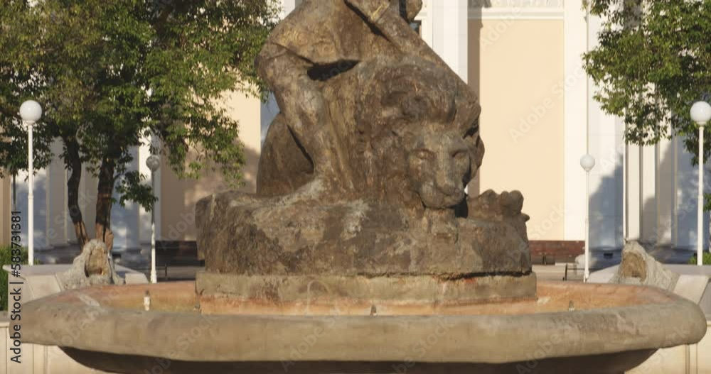 Tilt-up Reveal Of Statue From Georgian Mythology At The Fountain In Front Of Spring No. 6 Spa In Tskaltubo, Georgia. closeup Tilt-up Reveal Of Statue From Georgian Mythology At The Fountain In Front Of Spring No. 6 Spa In Tskaltubo, Georgia. closeup