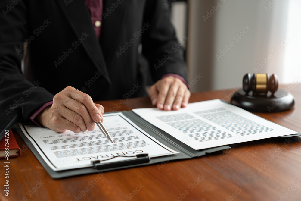 Fototapeta premium Female lawyer, legal consultant, asian businesswoman checking documents before signing venture capital business finance legal services concept in office.