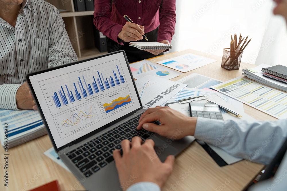 A group of Asian businessmen are brainstorming to analyze financial reporting situations. Calculate your investments with this calculator, income, tax and accounting from data graphs at your desk. A group of Asian businessmen are brainstorming to analyze financial reporting situations. Calculate your investments with this calculator, income, tax and accounting from data graphs at your desk.