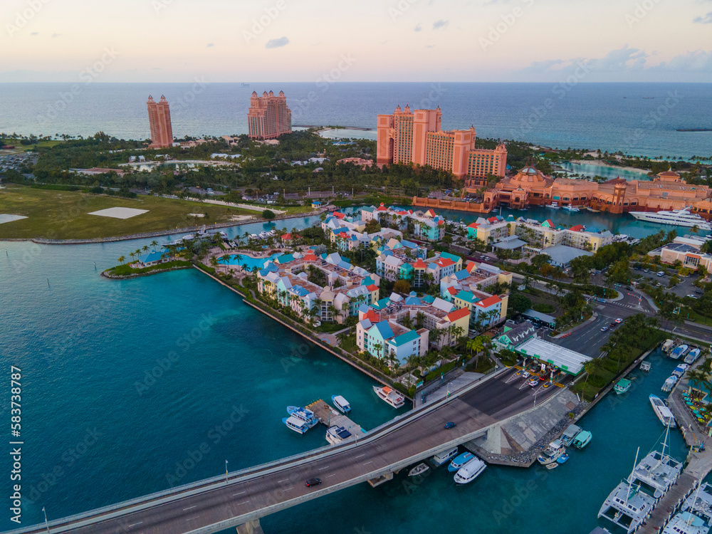 Harborside Villas aerial view at sunset with Atlantis Hotel at the background at Nassau Harbour, from Paradise Island, Bahamas.