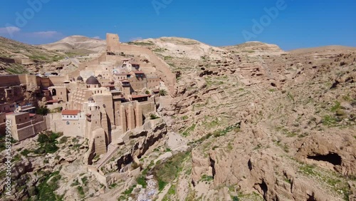 bethlehem, Palestine: The Greek Orthodox Mar Saba monastery in the Judean desert outside bethlehem in Palestine. Shot with a panoramic motion.  photo