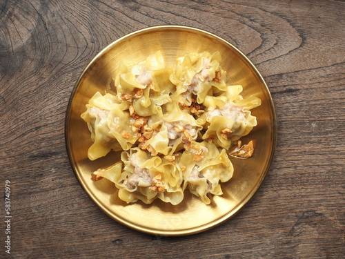 Photography Top view Chinese steamed dumplings on golden plate