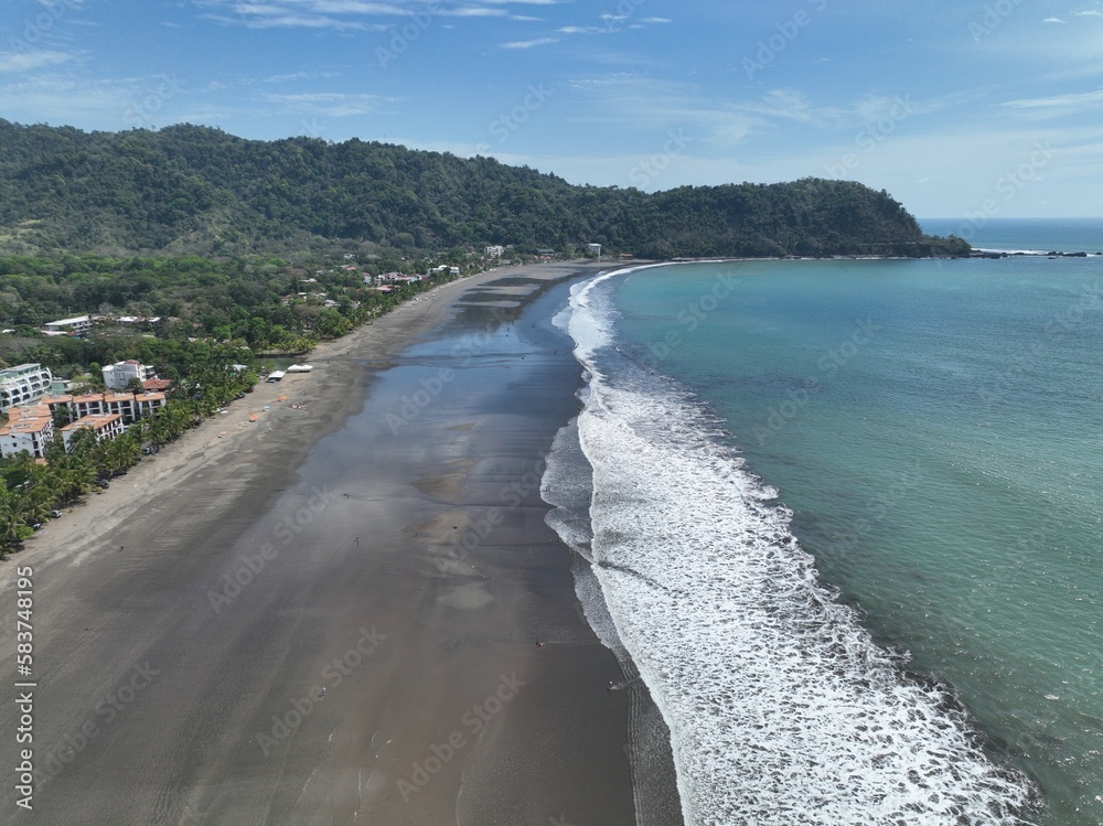 From above, Jaco Beach in Costa Rica is a stunning sight: white sands, blue waters, and lush greenery lining the shore.
