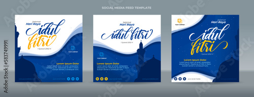 Handwriting Calligraphy Selamat Idul Fitri Translation of Happy Eid Mubarak in Indonesian. Greetings cards with mosque silhouette on blue gradient background - Template for social media feed post