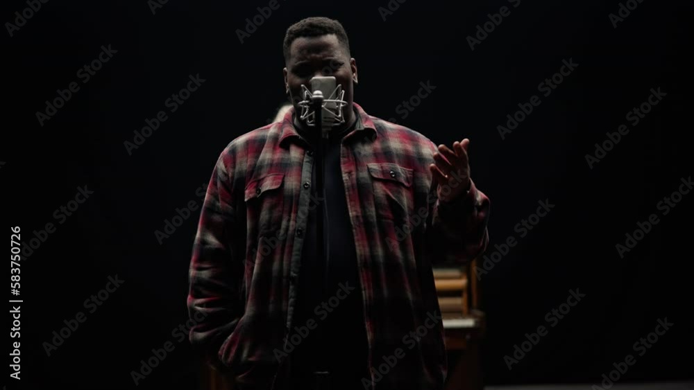 A Man Singing With Feelings In A Dark Studio A Man Singing With Feelings In A Dark Studio