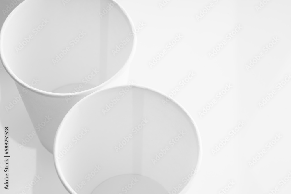 empty cardboard glasses close-up on a white background empty cardboard glasses close-up on a white background