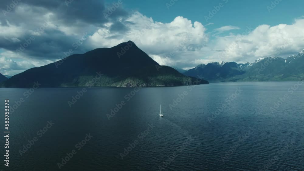 Ship sailing towards a mountainous coastline. Ship sailing towards a mountainous coastline.