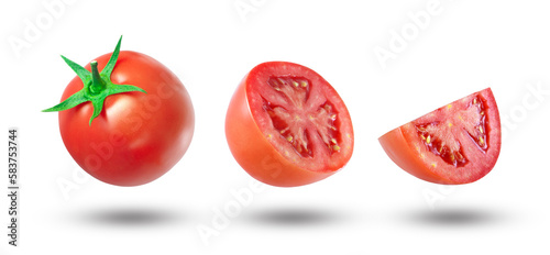 Flying tomato with half slice tomatoes isolated on white background.