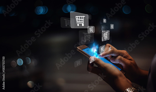 Businesswoman using phone and icon network connection data with growth graph customer, digital marketing, banking,concept e-commerce add to basket online shopping business technology internet network