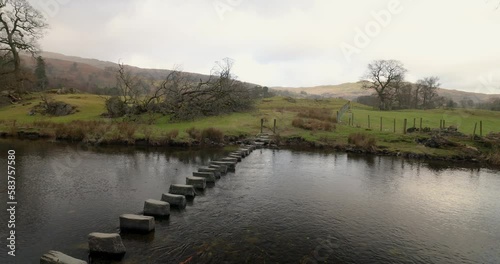Stepping stones across the River Rothay near Ambleside in the Lake District, Cumbria, North West England photo