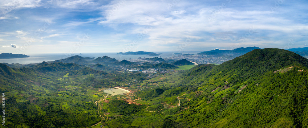 Panoramic photo of dawn viewed from the high mountains, in the distance is the famous coastal tourist city of Nha Trang, Khanh Hoa province, Vietnam