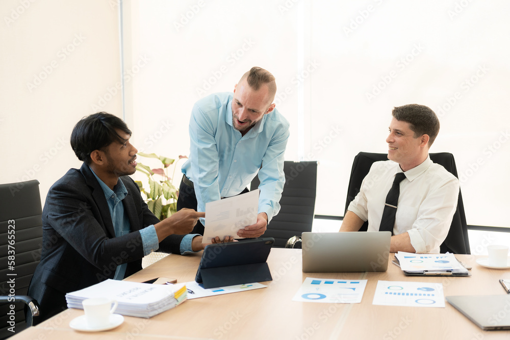 Diverse teams of top managers discuss, brainstorm, use digital tablets. Business partners discuss financial reports. Planning investment strategy in real estate Diverse teams of top managers discuss, brainstorm, use digital tablets. Business partners discuss financial reports. Planning investment strategy in real estate