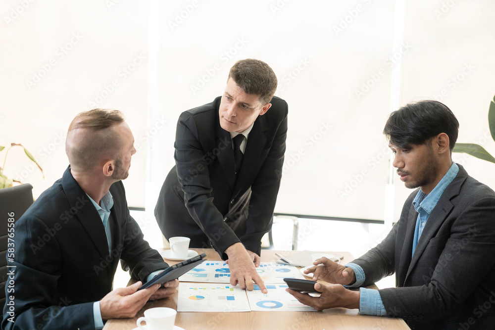 Diverse teams of top managers discuss, brainstorm, use digital tablets. Business partners discuss financial reports. Planning investment strategy in real estate Diverse teams of top managers discuss, brainstorm, use digital tablets. Business partners discuss financial reports. Planning investment strategy in real estate