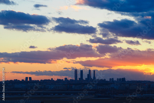 view of madrid at sunset with its skyscrapers photo