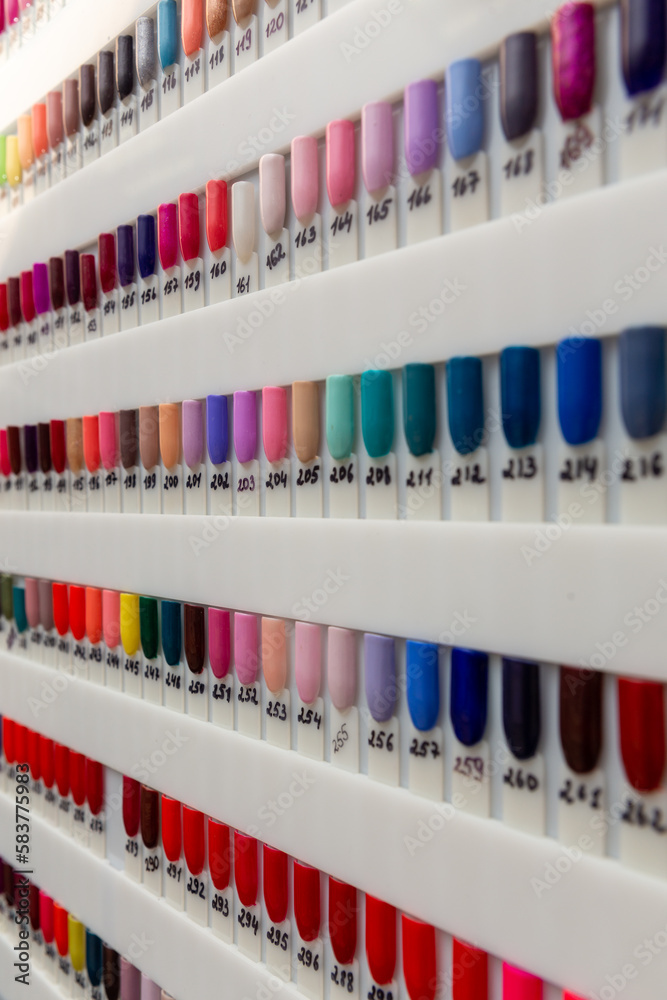 Nail polish samples of different bright colors on a white background.