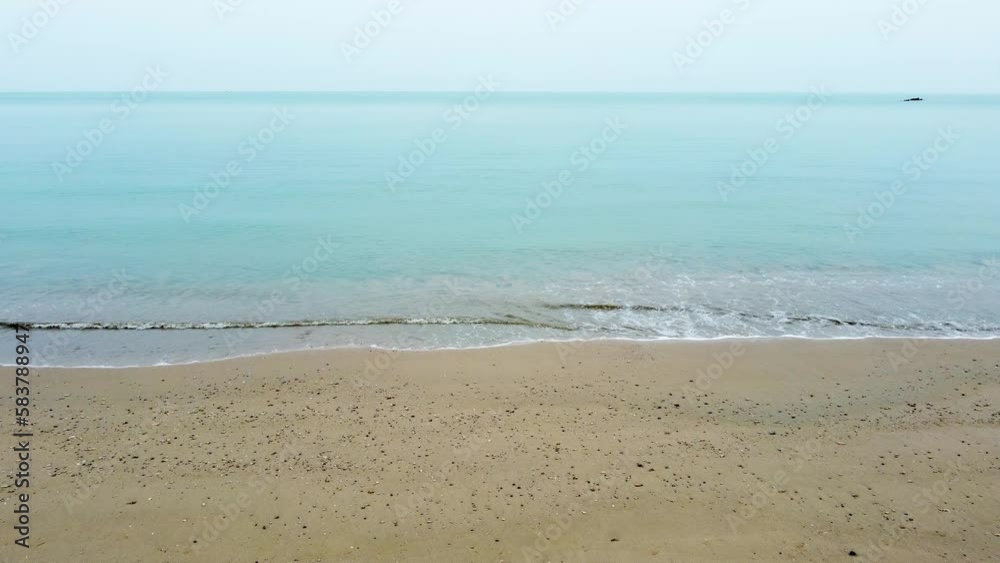 Top view of beautiful tropical beach seamless loop footage. Amazing Sandy coastline with white turquoise sea waves. Drone moving forward over sea Top view of beautiful tropical beach seamless loop footage. Amazing Sandy coastline with white turquoise sea waves. Drone moving forward over sea