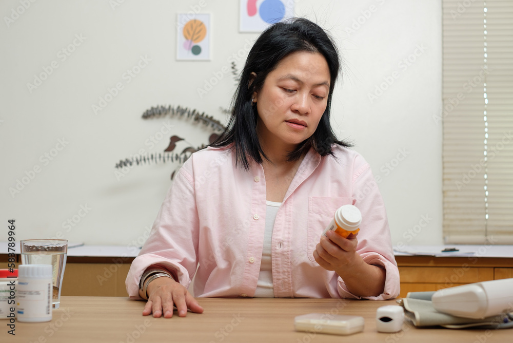 pov asian woman look at computer screen when visit doctor on video call at home pov asian woman look at computer screen when visit doctor on video call at home