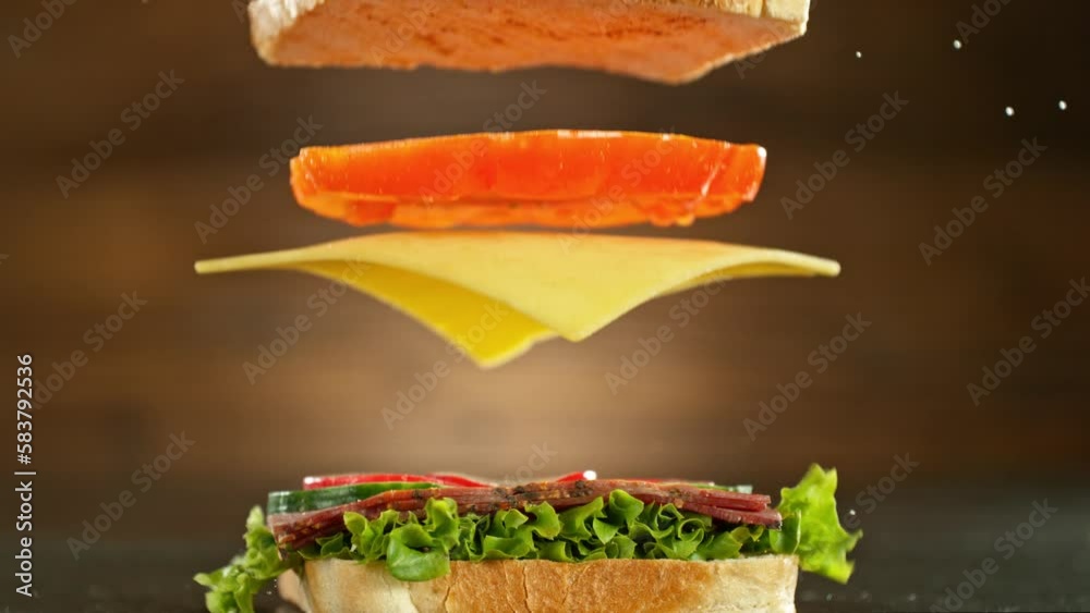 Super slow motion of stacking sandwich pieces. Camera in motion. Filmed on high speed cinema camera, 1000 fps. Placed on high speed cine bot.