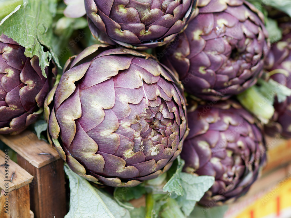 Fototapeta premium Background of fresh artichokes at market