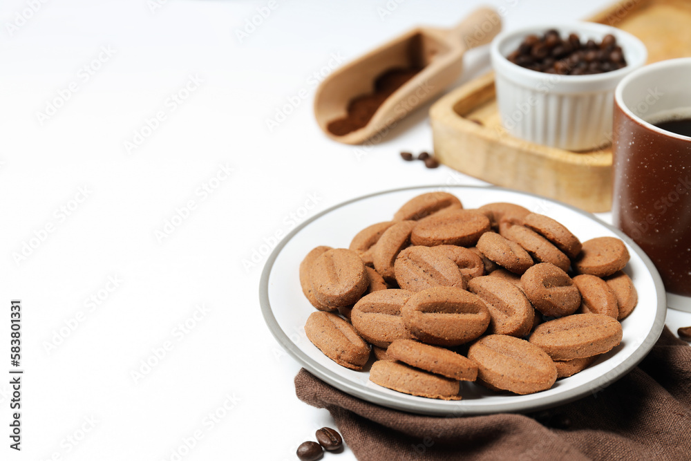 Concept of tasty snack for hot drink - cookies in the shape of coffee seeds Concept of tasty snack for hot drink - cookies in the shape of coffee seeds