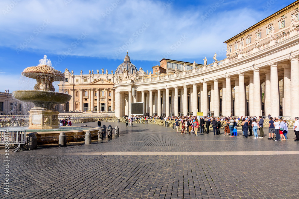 People standing in line to visit St. Peter's Basilica on St. Peter's square, Vatican