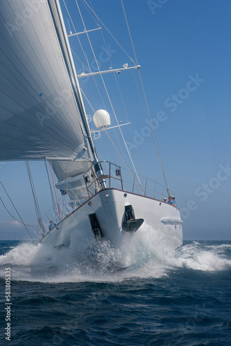 Super sailing yacht in full sail. Power sailing. Sailing at sea. Action. Mediterranean Sea. © A