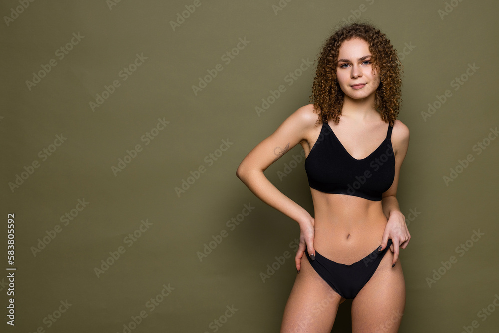 Fototapeta premium sexy girl in black lingerie. concept of home clothes and photos on the catalog