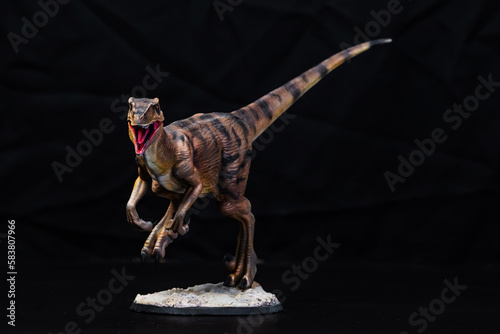 The Velociraptor dinosaur in the dark