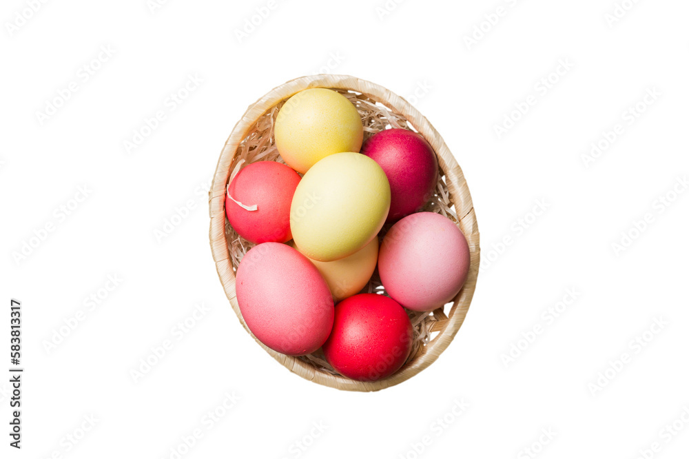 Basket of colorful Easter eggs isolated on white background. Easter basket filled with colored eggs top view holiday concept Basket of colorful Easter eggs isolated on white background. Easter basket filled with colored eggs top view holiday concept
