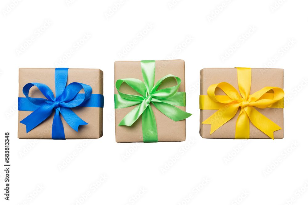 Holiday present box on a Isolated. Gift box with colored bow on white background top view close up