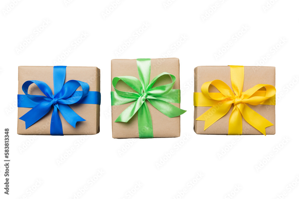 Holiday present box on a Isolated. Gift box with colored bow on white background top view close up Holiday present box on a Isolated. Gift box with colored bow on white background top view close up