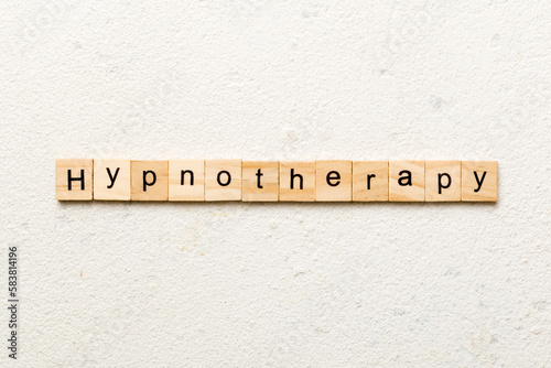 Hypnotherapy word written on wood block. Hypnotherapy text on cement table for your desing, concept