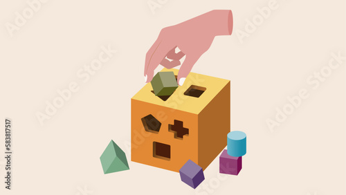 A hand playing shape sorting cube. Problem solving.