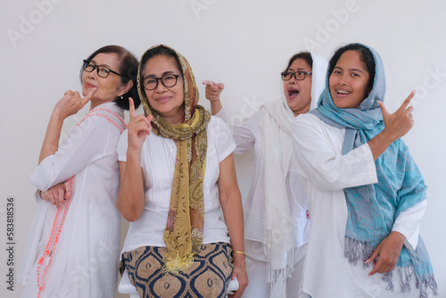 Four sisters gathering on Ramadan day and taking photo together photo