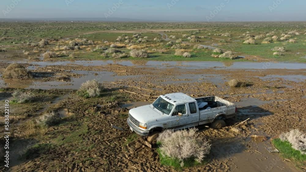 Offroading in the Mojave Desert, trucks stuck in the mud in the aftermath of an unexpected