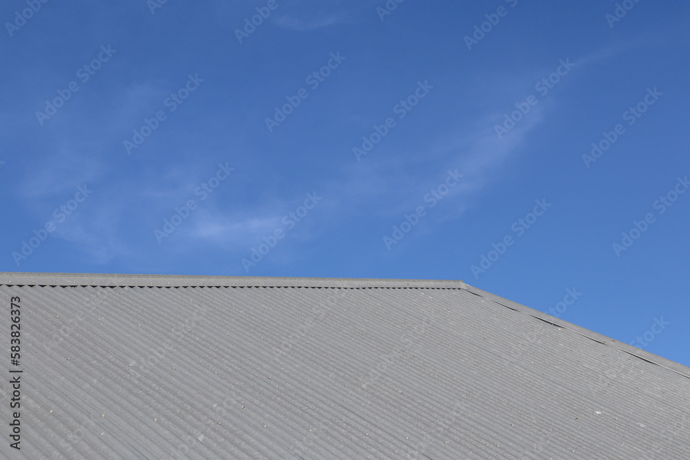 corrugated steel roof of building and sky