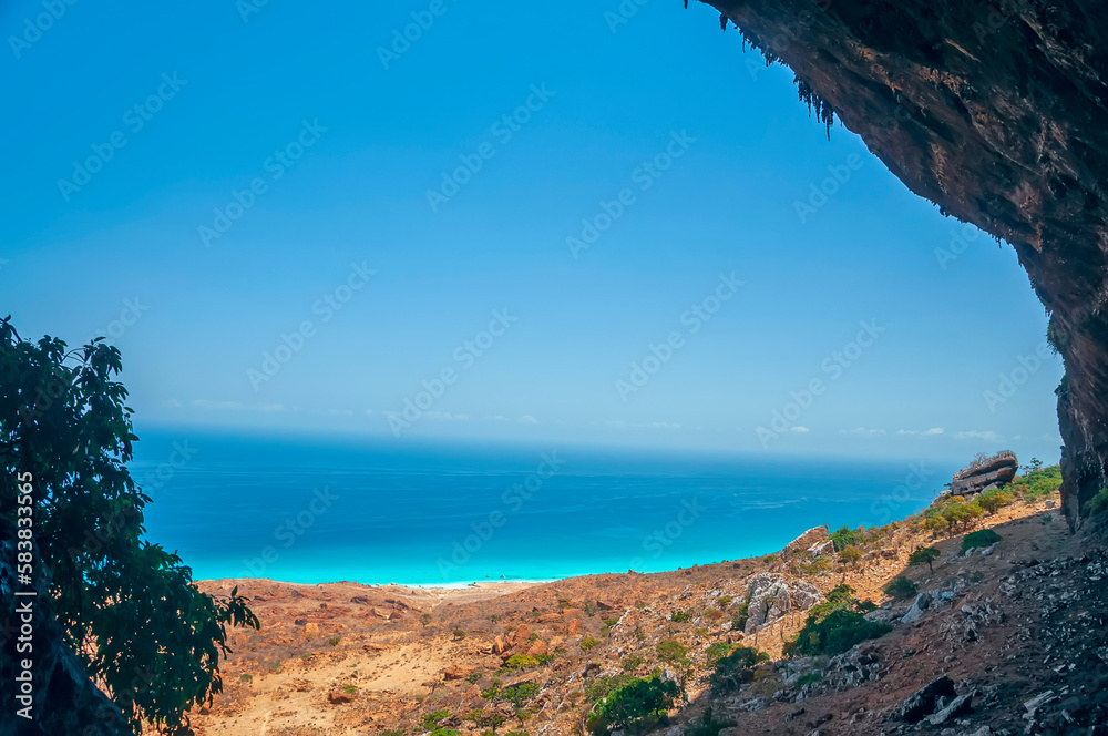 View from the top of the cave on the wild coast of the Indian Ocean. Socotra island.