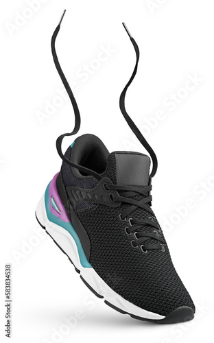 Fotografie Black sneaker with flying laces stands on the tip isolated on transparent background