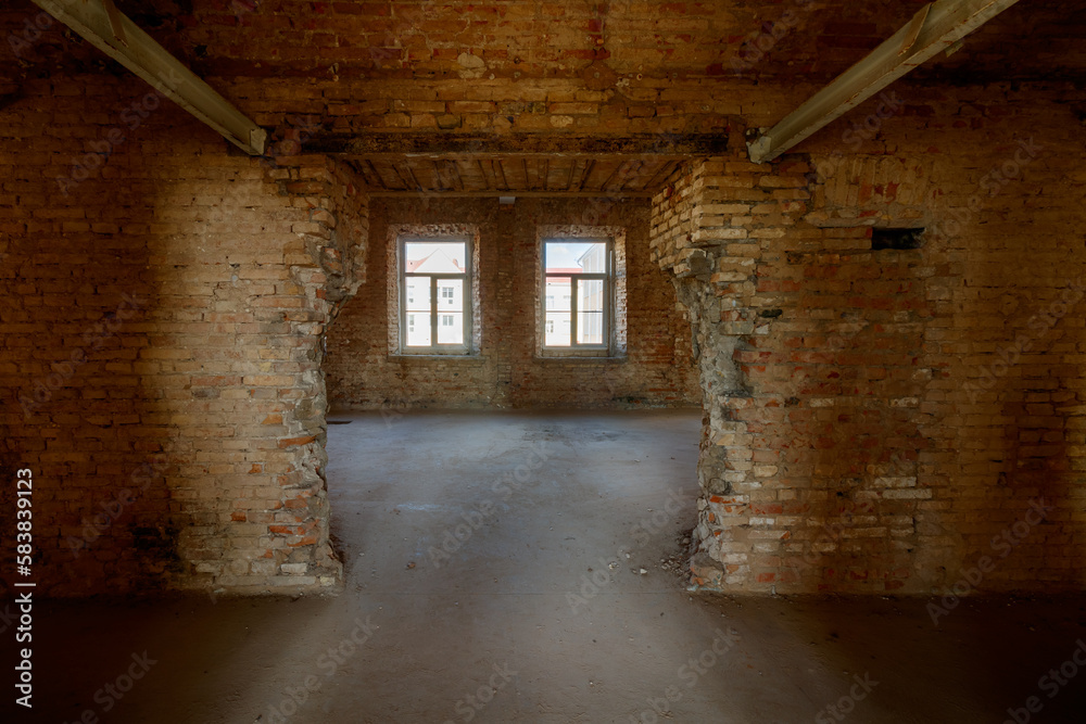 Fototapeta premium Old grunge interior with a destroyed brick wall