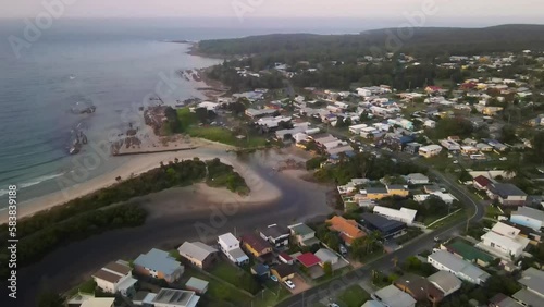 Aerial drone view of Currarong village in the City of Shoalhaven on the shores of Jervis Bay, NSW, Australia, showing Currarong Creek in the late afternoon      photo