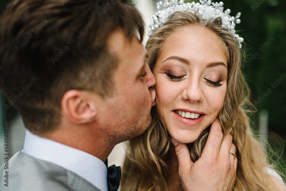 The bride and groom. First meeting. Newlyweds standing on the terrace, balcony, backyard. Outdoors. Happy wedding day of marriage. The bride and groom. First meeting. Newlyweds standing on the terrace, balcony, backyard. Outdoors. Happy wedding day of marriage.