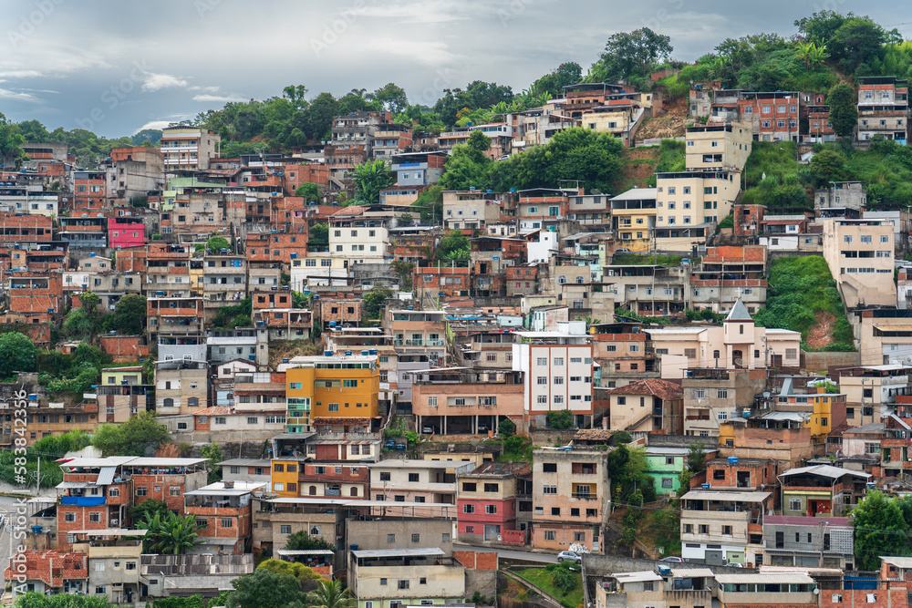 Colorful Favelas Covering Mountain Slope