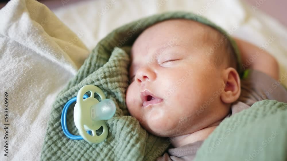 newborn baby with pacifier sleep. dream kindergarten a family concept