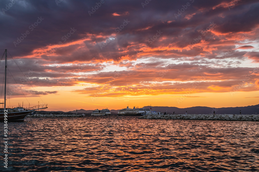 Sunset over New Port in historic part of Corfu town on Corfu Island in Greece