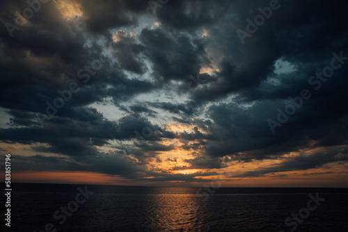 sea at sunset sky in clouds of sunshine nature boat trip