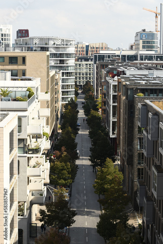 Vertical aerial view of Am Kaiserkai avenue buildings and trees on a sunny day in Hamburg, Germany photo